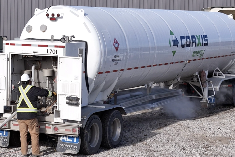 driver unloading LNG truck on site